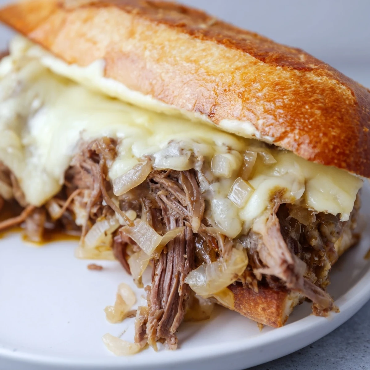Golden shredded beef piled on toasted hoagie rolls with melted provolone cheese
