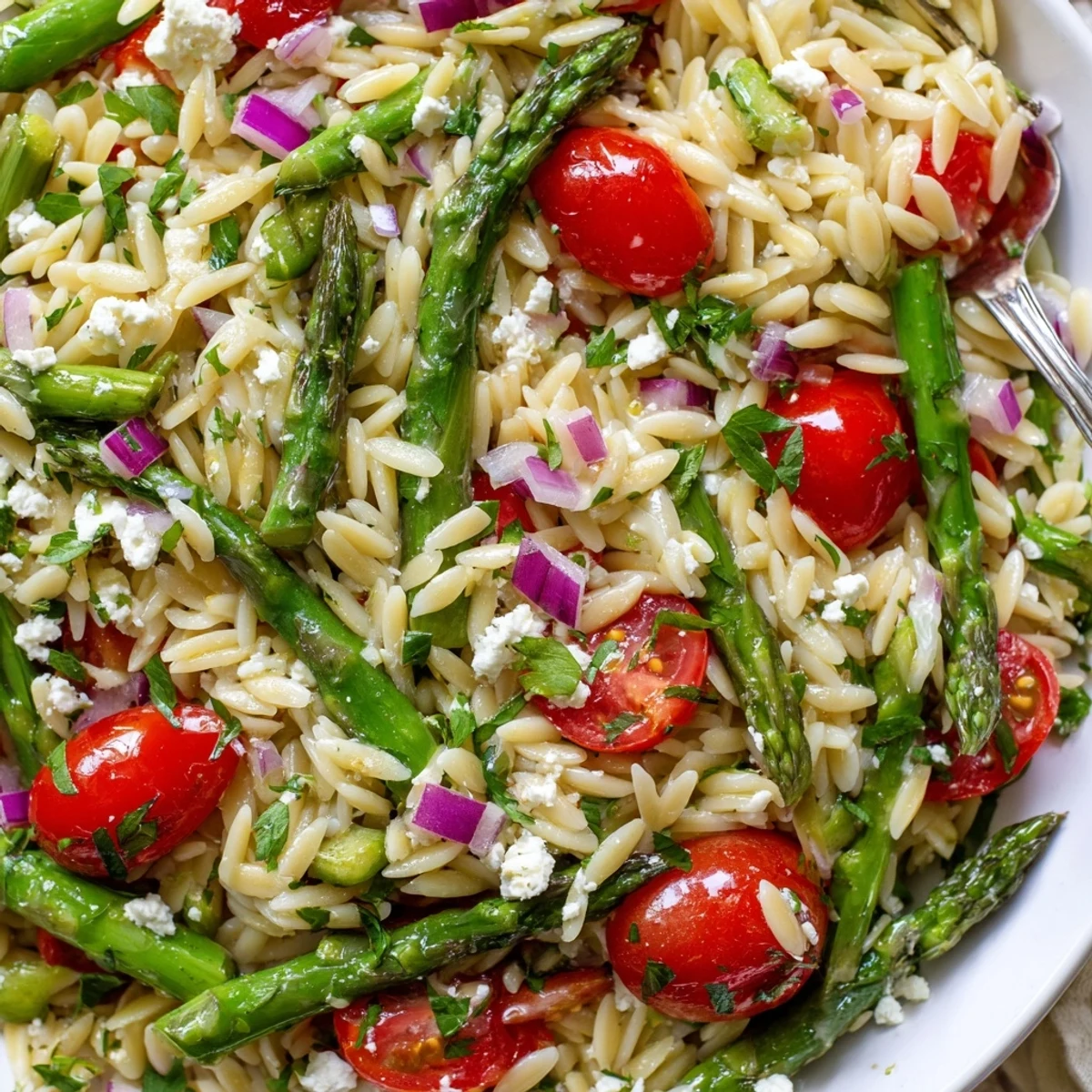 Fresh Asparagus Orzo Salad With Lemon Vinaigrette tossed with parsley, garlic aroma
