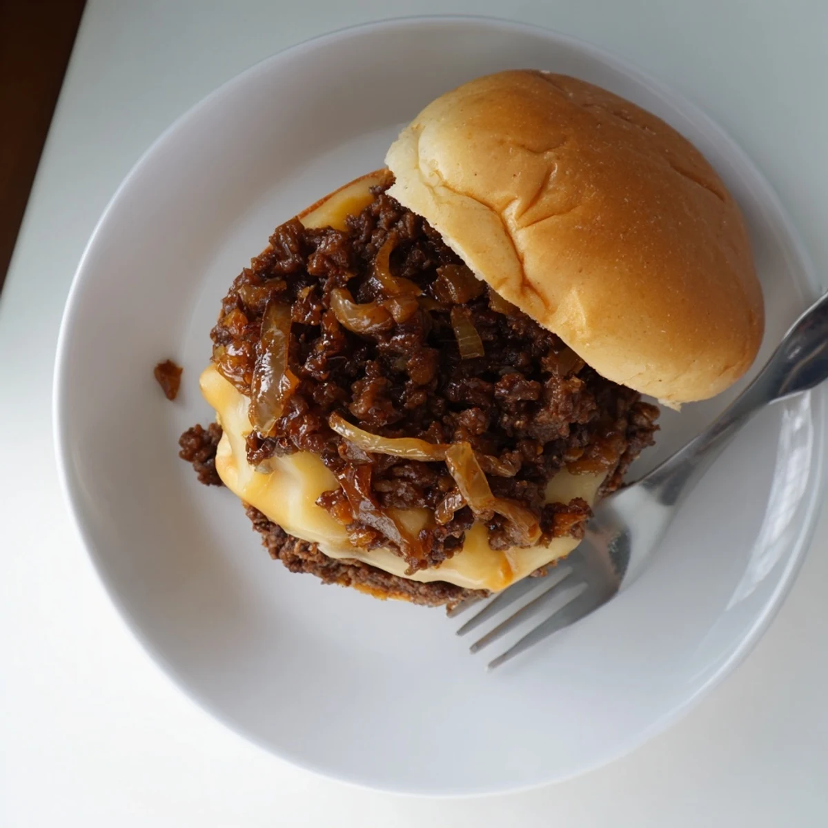 Golden caramelized onions and seasoned ground beef piled on toasted buns with melted provolone cheese in these French onion beef sloppy joes