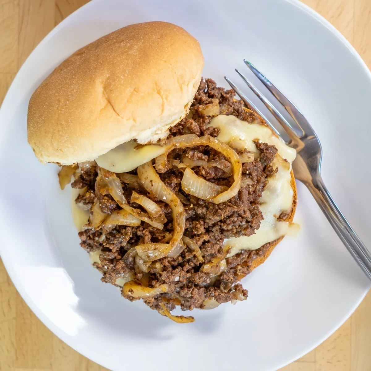 Savory French onion beef sloppy jores served open-faced with gooey melted cheese and sweet caramelized onions on golden toasted bread