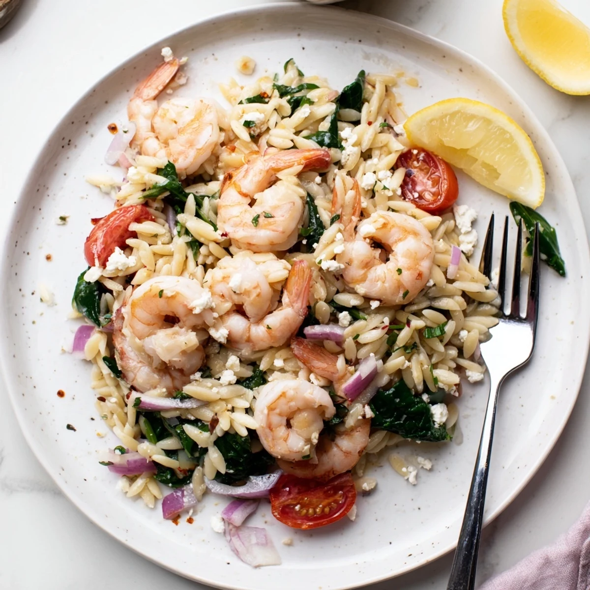 Garlic sauteed shrimp and juicy tomatoes in Lemon Feta Orzo Shrimp Recipe, flaky feta