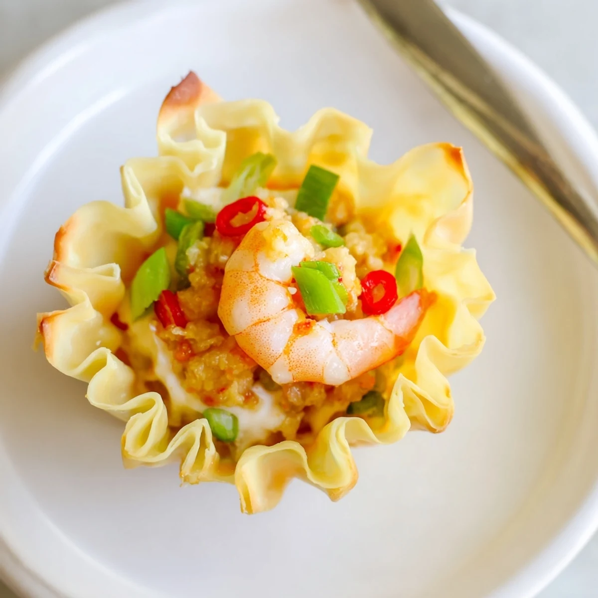 Crispy Shrimp Wonton Cups With Lime Cream, golden cups topped with cilantro.
